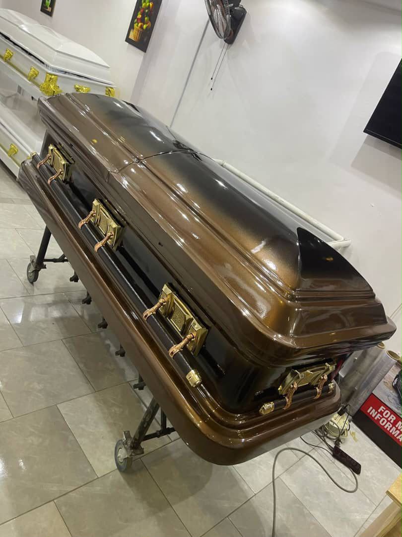 Gloss bronze-brown casket with gold-tone hardware