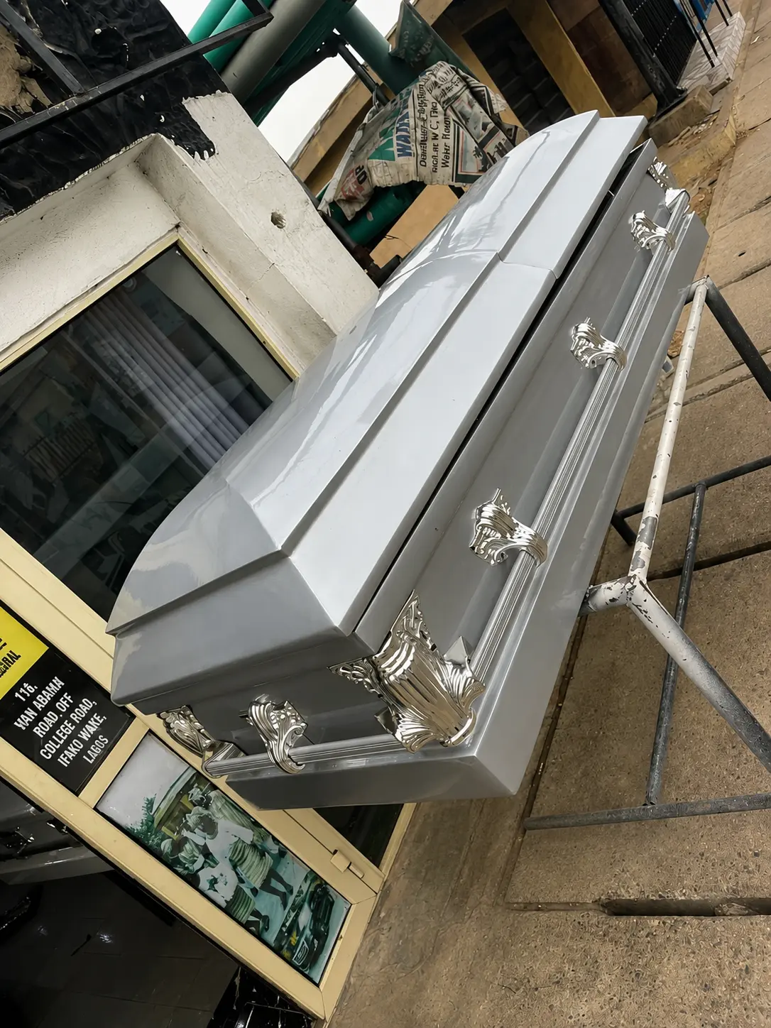 Silver grey casket with polished silver ornamental handles